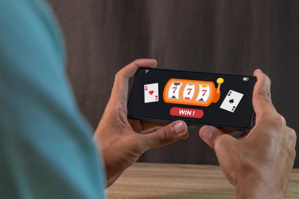 Mobile phone showing senjatogel deposit screen with DANA, OVO, GoPay, and QRIS options